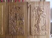 Carved panels made of chestnut wood, bas-reliefs 'Cilento senza parole' (Cilento without words) and 'Tralcio d'uva' (Grape shoot)