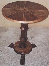 Round table in walnut with marquetry