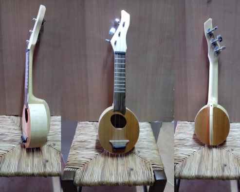 Guitar Avgó. Cherry, maple and toulipier wood. Three strings. In Greek avgó / αυγό means egg. Size: 44 x 13 x 5 cm.